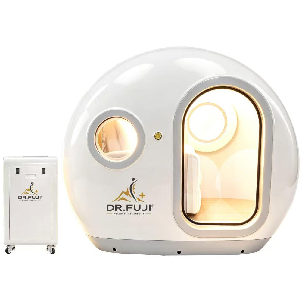A white Dr. Fuji wellness device with a rounded capsule-like exterior, a large arched viewing window showing warm interior lighting, a smaller circular window, and a separate white wheeled control or accessory unit beside it on a light gray background.