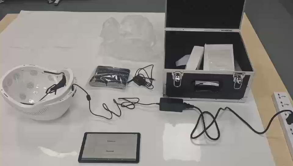 Dr. Fuji brain photobiomodulation helmet components and accessories displayed for product setup and demonstration.